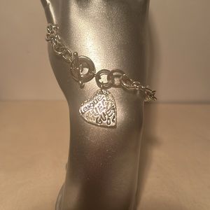 Guess 8 Inch Big Link Silver-Toned Bracelet with Heart Charm.